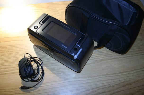 In the box: printer, case with cool swirly design, power adapter, "introductory" ink cartridge" that has less ink than the replacement cartridges, which are good for about 50 prints.