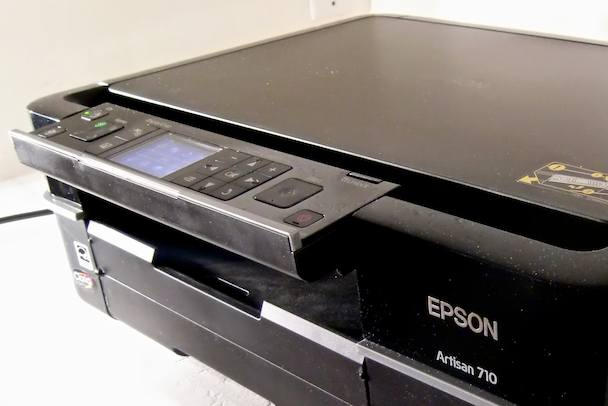 The printer's entire faceplate pivots incrementally within a 90 degree range.