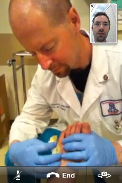 iPhone 4 Video medical consult: Dr. David Armstrong confers with Dr. Lee Rogers (inset).