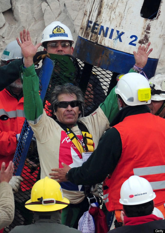 A rescued miner wears the protective Oakley sunglasses in the care kit.
