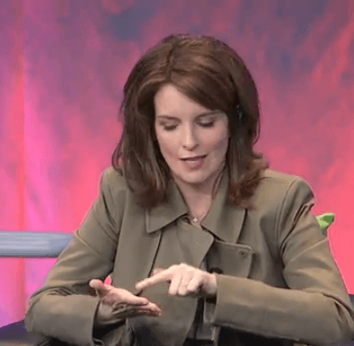 Tina Fey mimes using her iPhone during the Google chat.
