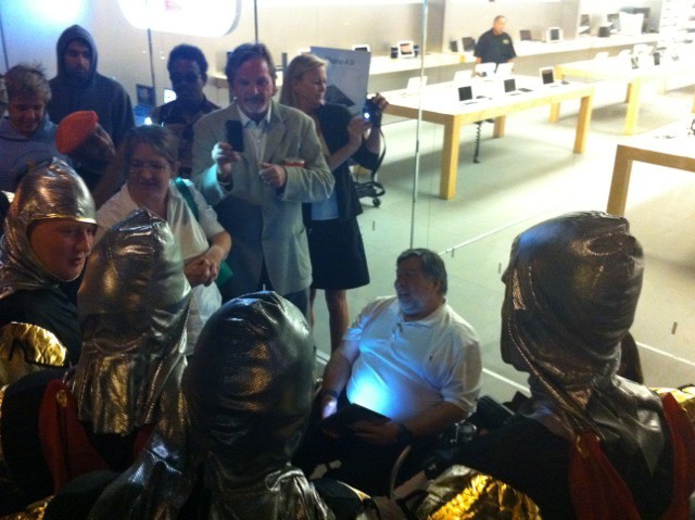Woz is first in line for an iPhone 4S at Apple's Los Gatos store. Here he is surrounded by a group of drunken knights from England, according to our stringer Mike Elgan.