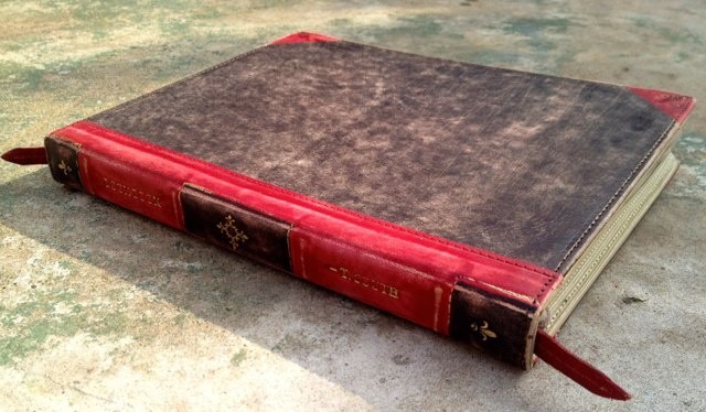 The BookBook is handmade from premium leather and designed to look like a vintage book.