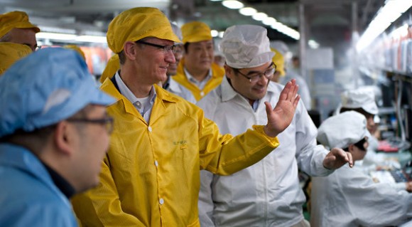 Tim Cook greeting Foxconn workers in China. Photo: Apple