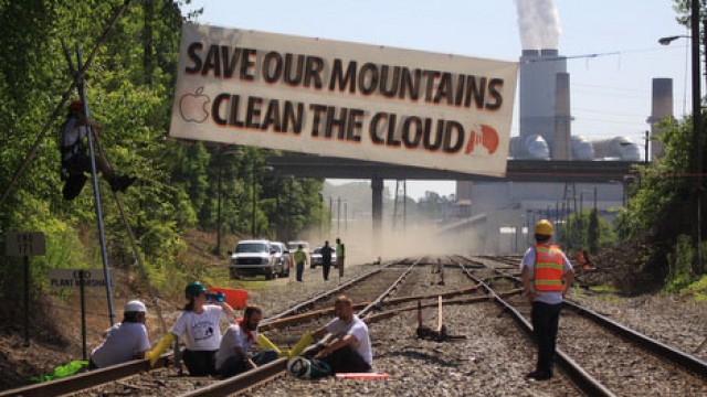 Environmental protesters in 2012 block coal trains meant to power Apple's Maiden, NC data facility.