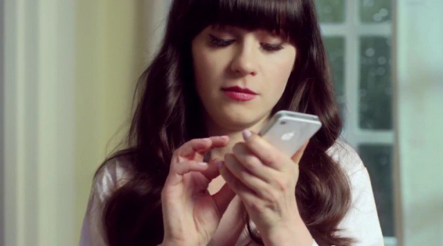 Zooey loves her iPhone.
