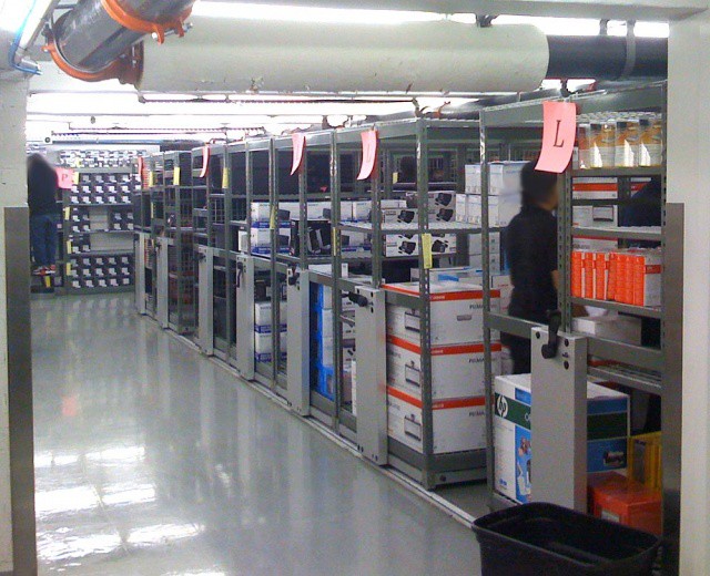 Rolling shelves fill the Apple Store's back-of-house.