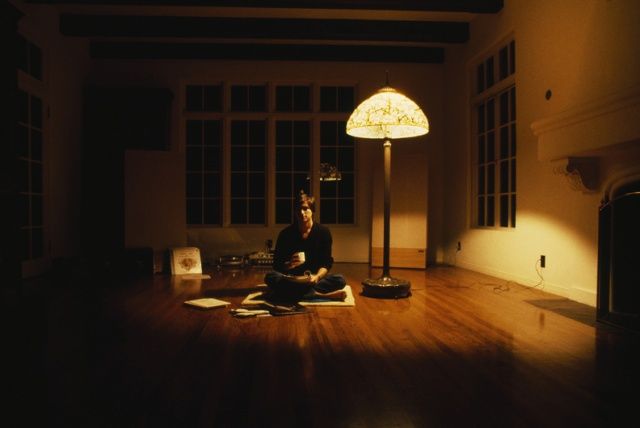 Steve Jobs sitting on the floor in the house Jamis MacNiven helped him restore. Photo: Diana Walker.