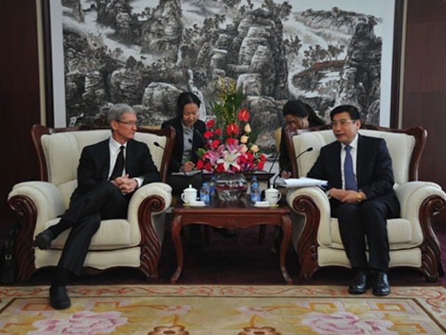 Tim Cook with Miao Wei, the head of China’s Ministry of Industry and Information Technology