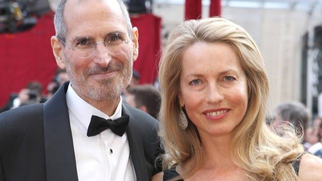 Who's that good looking guy standing next to Laurene Powell Jobs?