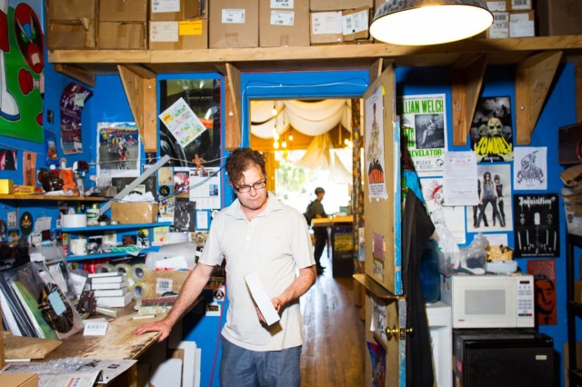 Jim Haynes, assistant manager at Aquarius Records in San Francisco, spends his morning in the back room boxing up orders from across the country.
