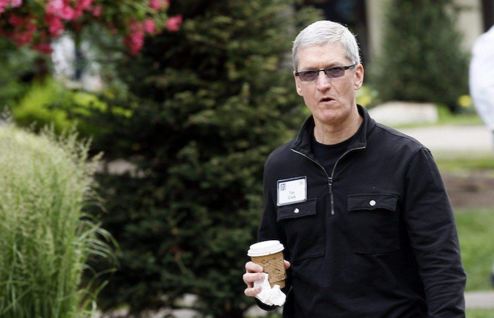 Tim Cook looking smug at Sun Valley last year. (photo by Rick Wilking, Reuters)