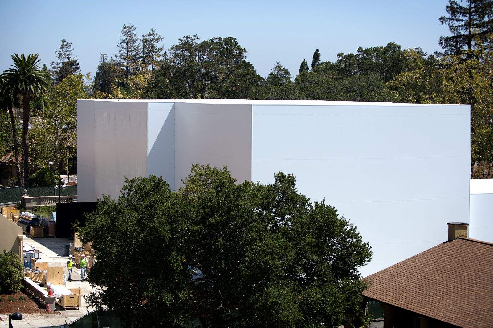 CUPERTINO, California -- What's inside the mystery building Apple is fabricating for its big September 9 event? The giant construction project is almost as big of an enigma as what the iWatch will actually look like or do.


The boxy structure, which sprang up behind the Flint Center for the Performing Arts here on the De Anza College campus, looks like a cross between an igloo and a winning confection on Cake Wars.  Naturally, the enormous two-to-three story building sparked intense curiosity among the Apple faithful when pictures emerged Thursday, so we had to go take a look for ourselves.


Will it hold something as mundane as a demo area where tech journalists can fondle Apple's latest, greatest gear? Does it contain a full-size home of the future to show off amazing HomeKit implementations? Will it house a runway for an Apple wearables fashion show or a giant stage for a post-announcement Dr. Dre concert?


Whatever it holds, it is truly a massive undertaking. It's surrounded by green fences and countless security guards. We, like you, can't wait for Apple's big reveal — here's what we saw walking around the outskirts of the secretive project Thursday afternoon.