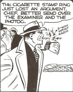 Detective Dick Tracy calling the chief on his wrist radio in a panel from Chester Ghould's comic strip.