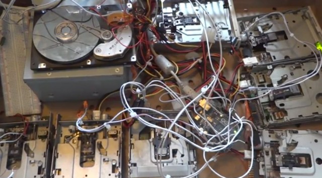Arganalth's original orchestra of drives for making music before using a smaller computer to make a more portable setup. Photo: Arganalth/YouTube 
