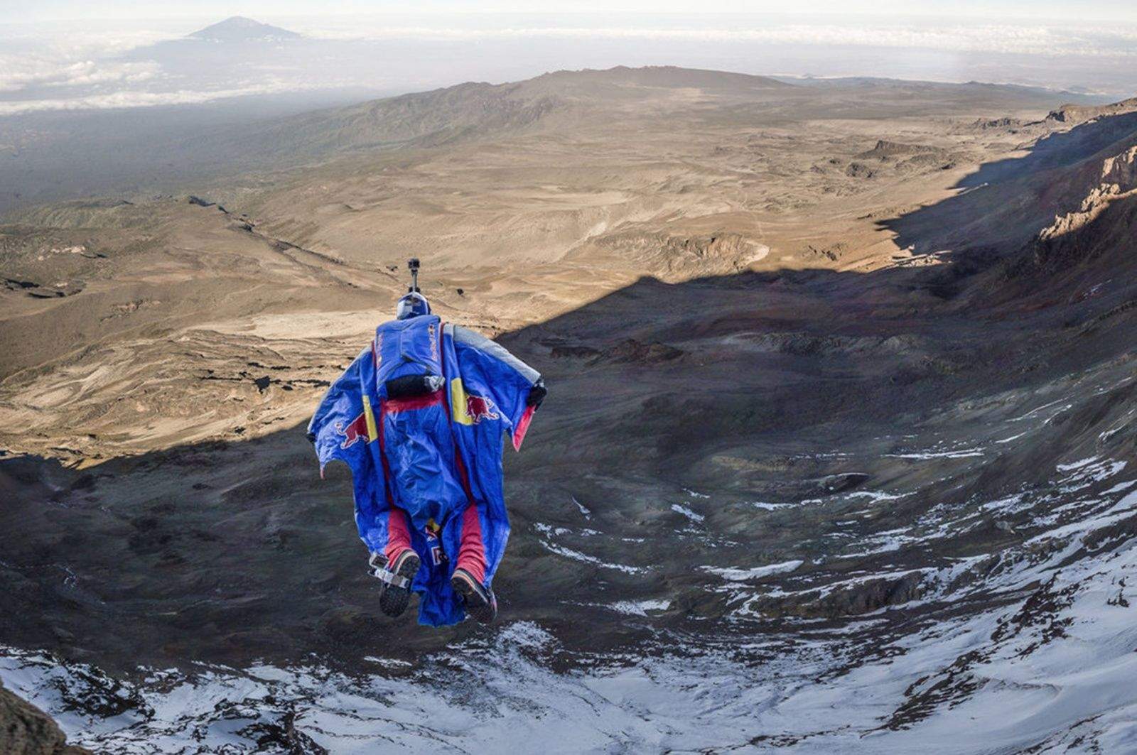 Russian BASE jumper Valery Rozov leaves his team behind after a recent wingsuit flight from Mount Kilimanjaro in Africa. Photo:  Thomas Senf / Red Bull Content Pool