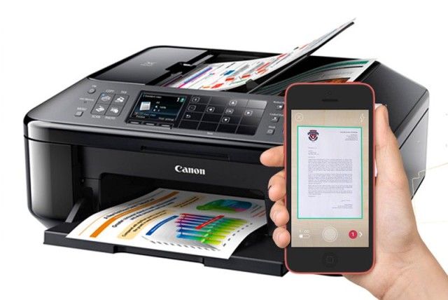 A Canon desktop scanner for at home, and an iPhone 6 for on-the-go. Photo: Cult of Mac