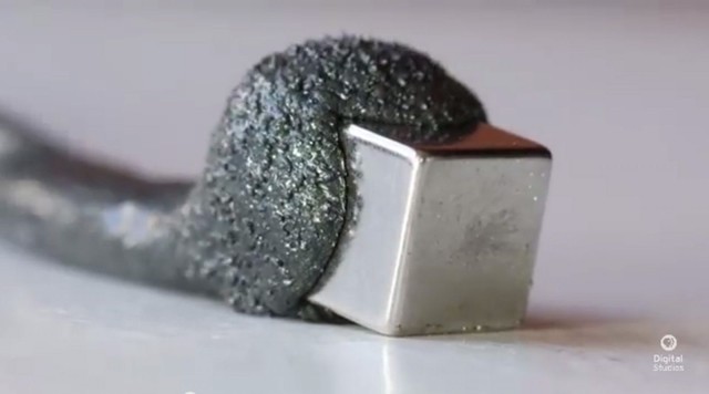 Magnetic putty contains tiny micron-sized micro magnets that get charges when around a magnet. Photo: Joey Shanks/YouTube Magnetic putty contains tiny micron-sized micro magnets that get charges when around a magnet. Photo: Joey Shanks/YouTube