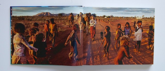 A double-truck photo of Robyn Davidson meeting up with Aborignal children during her journey across the Australian Outback. Photo: Rick Smolan/Against All Odds Production