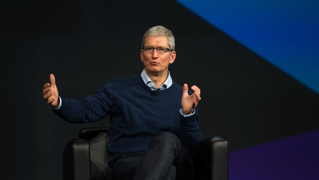 Photo of Apple CEO Tim Cook onstage at a conference