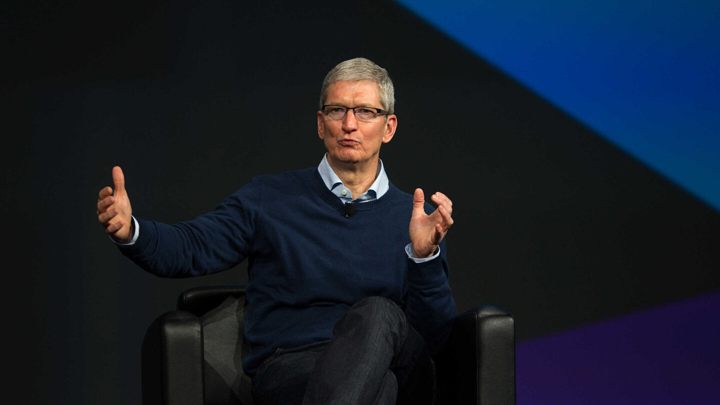 Photo of Apple CEO Tim Cook onstage at a conference