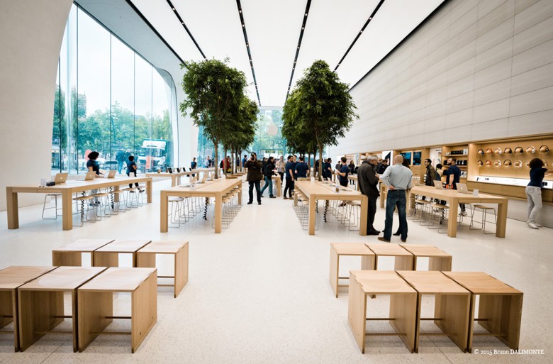 The Apple Store showroom in Brussels features trees and a greater use of wood.