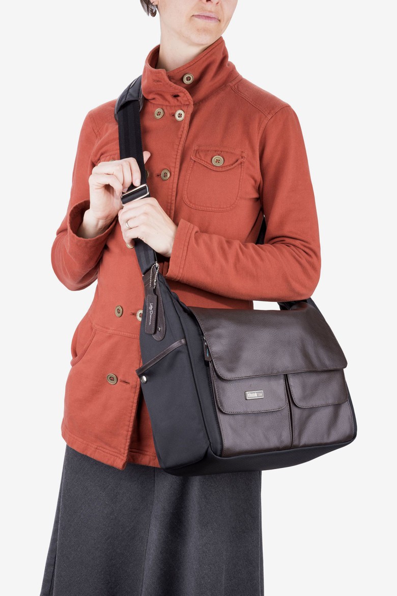 Women’s camera bags The Lily Deanne bag incorporates leather, metal and metal accents for elegant and still understated.