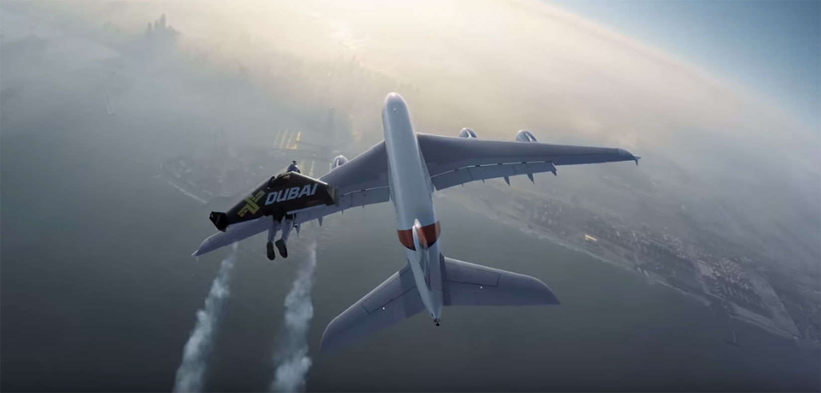 A Jetman Dubai pilot soars to catch up with an Emirates A380 commercial jet.