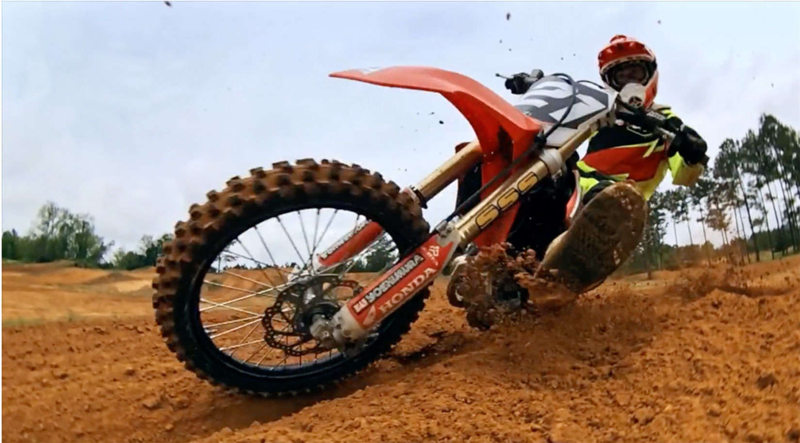 The iPhone in close at dirt level on a motocross track.