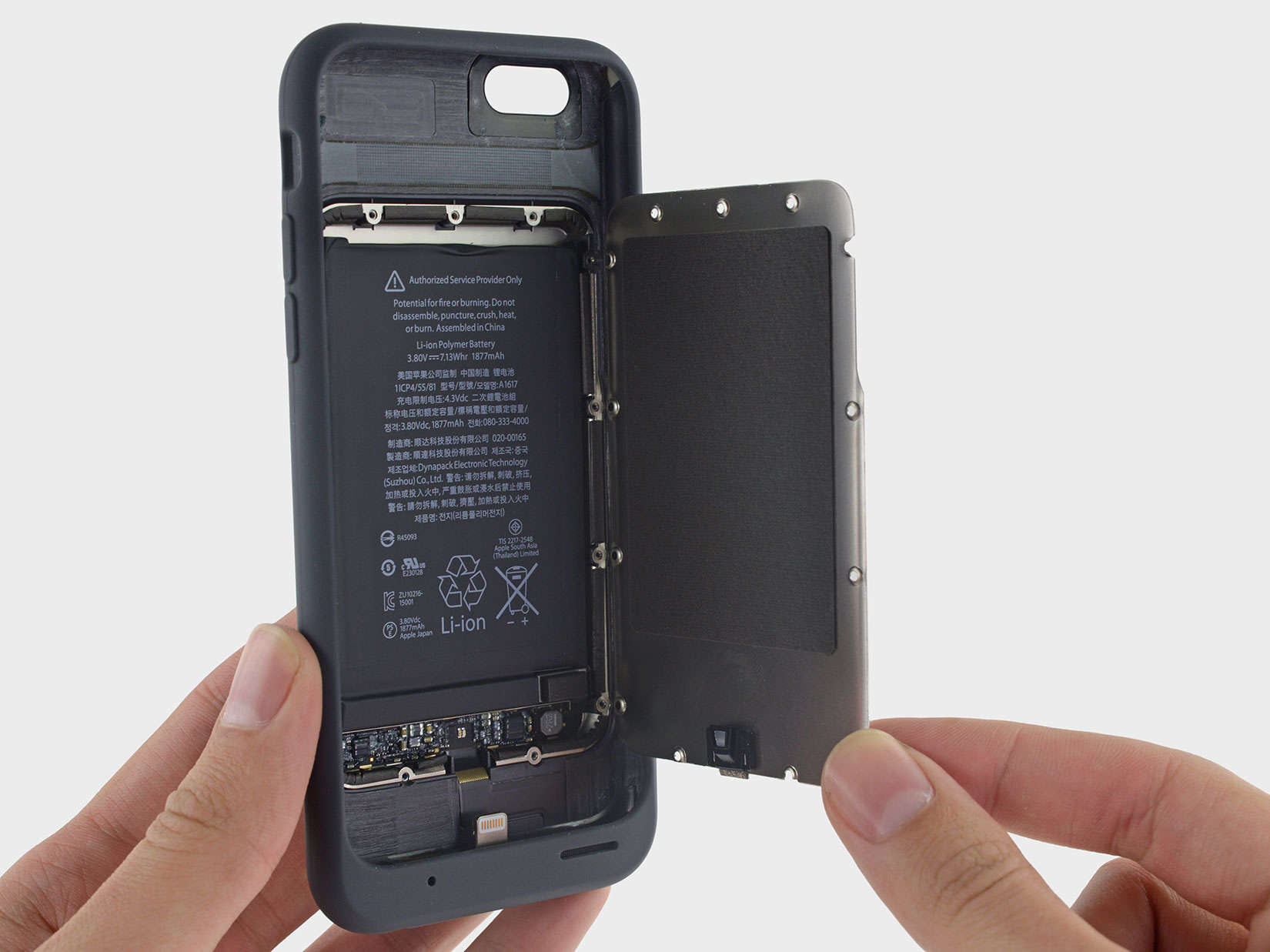 This metal plate is a door to the battery compartment and fortifies the case.