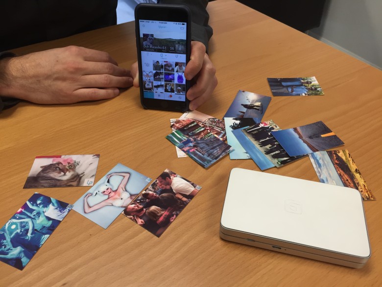 The LifePrint printer spits out small photos that can trigger videos in an app.