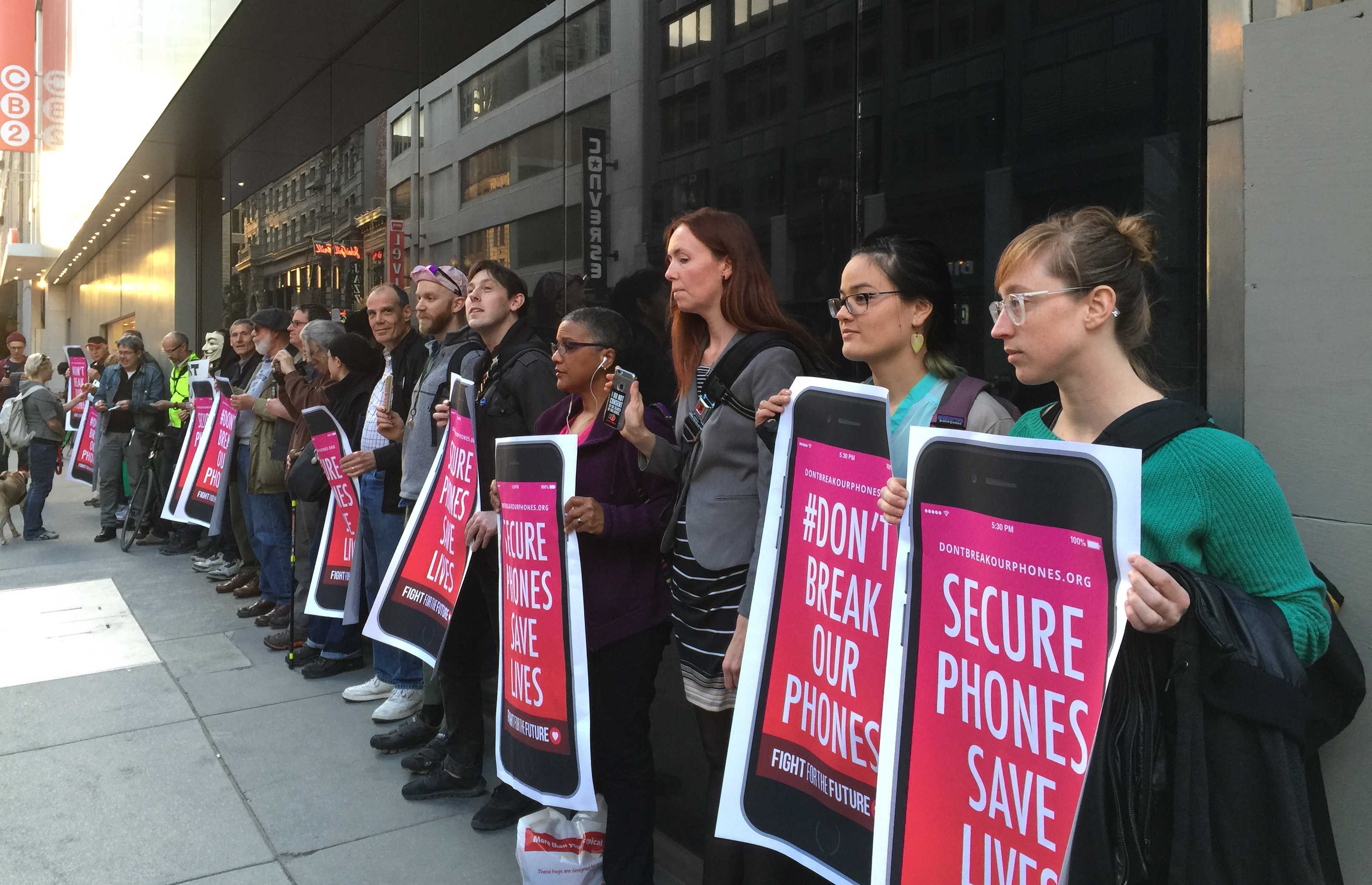 Protesters in San Francisco line up with pro-privacy signs outside the downtown Apple Store.