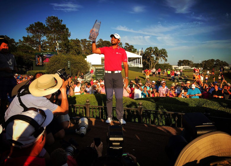 Jason Day holds up the winner's trophy after claiming THE PLAYERS Championship at TPC Sawgrass in Ponte Vedra Beach, Fla., in May.