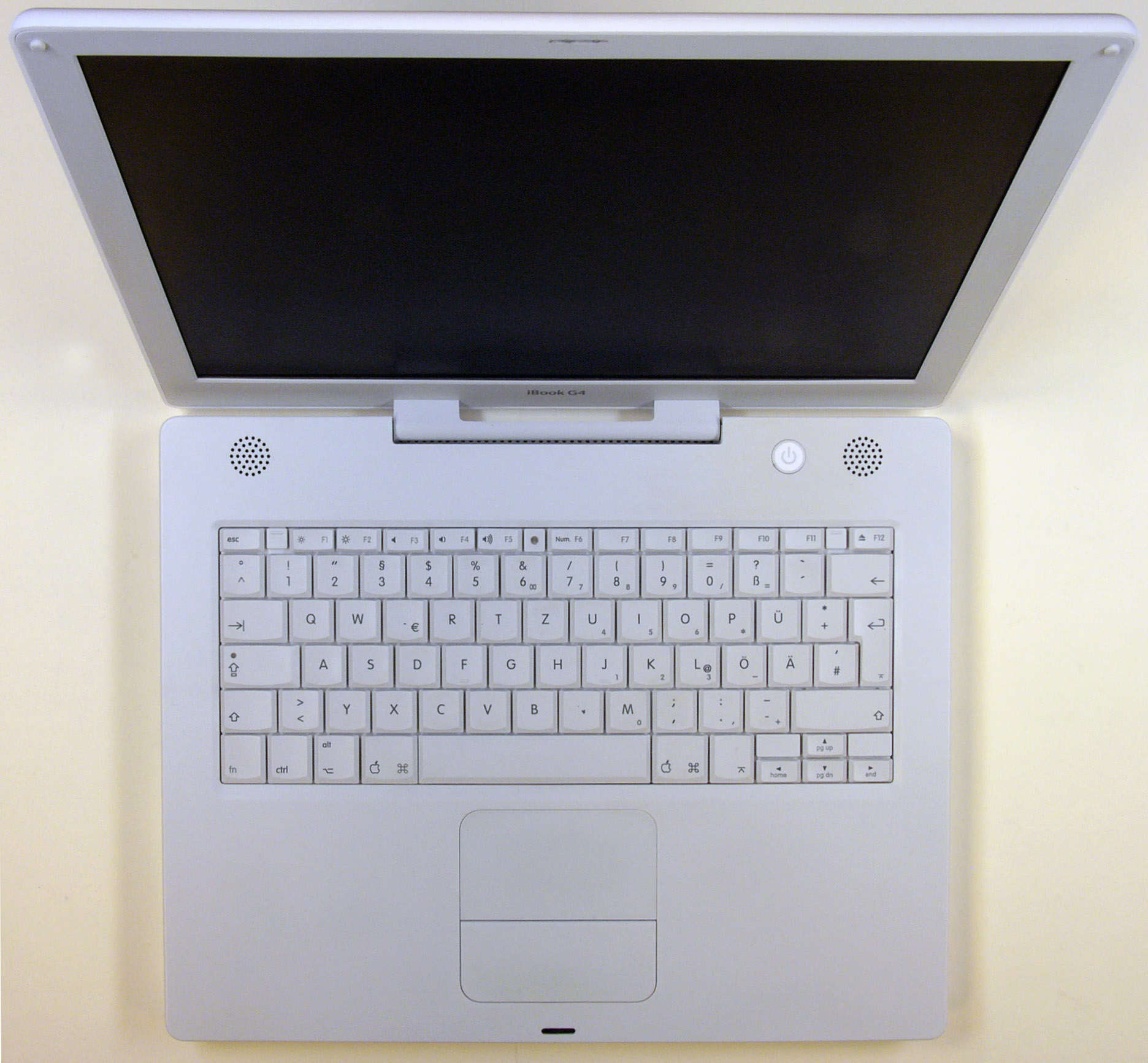 Rugged and pearly white, the iBook G4 becomes the last of its line.