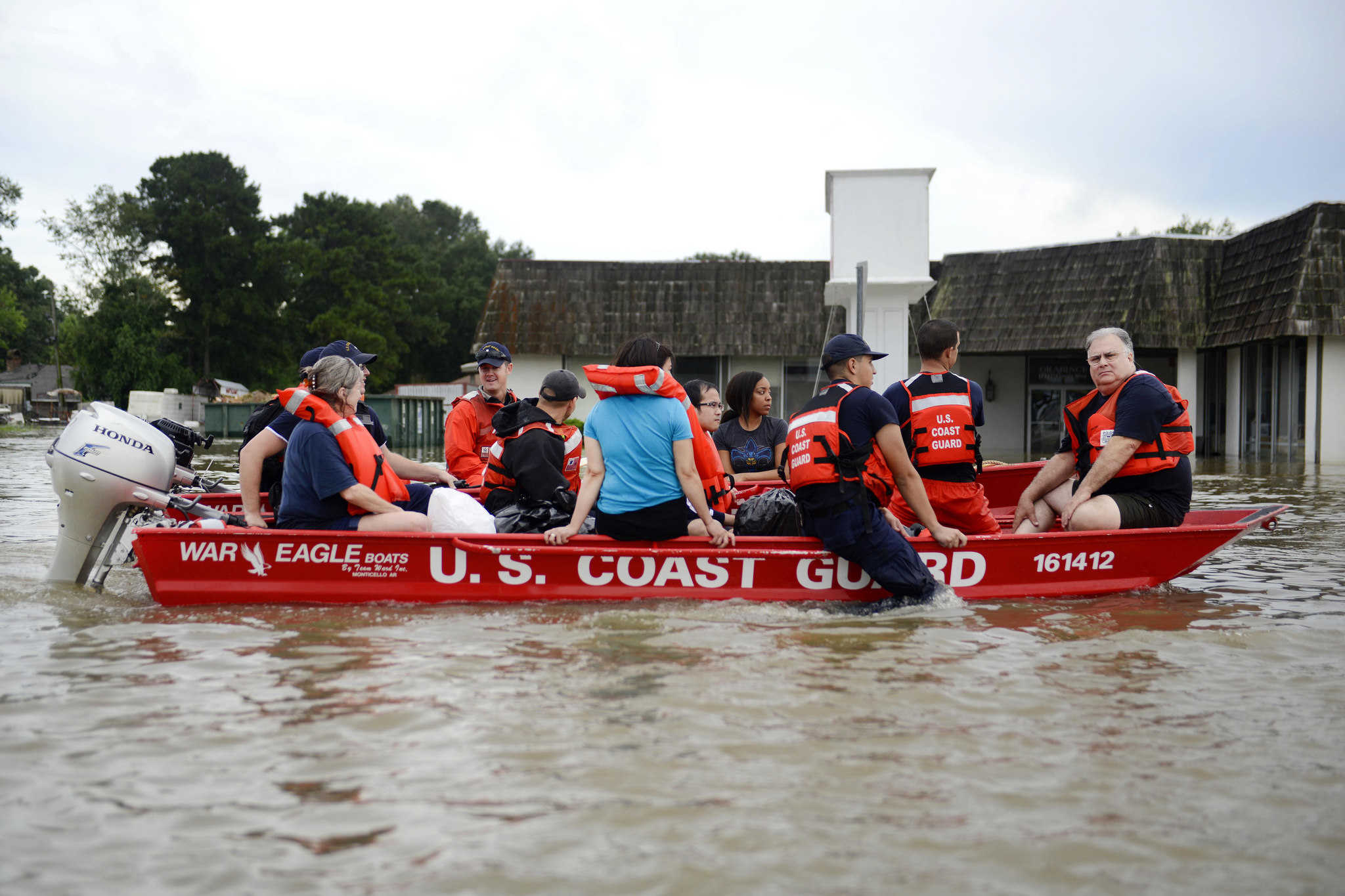 Coast Guardsmen rescue stranded residents from high water during severe flooding around Baton Rouge, Louisiana.