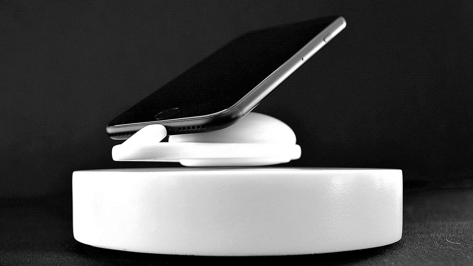 The iPhone can float along magnetic waves as it charges.