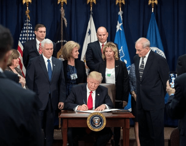 Donald Trump signing document