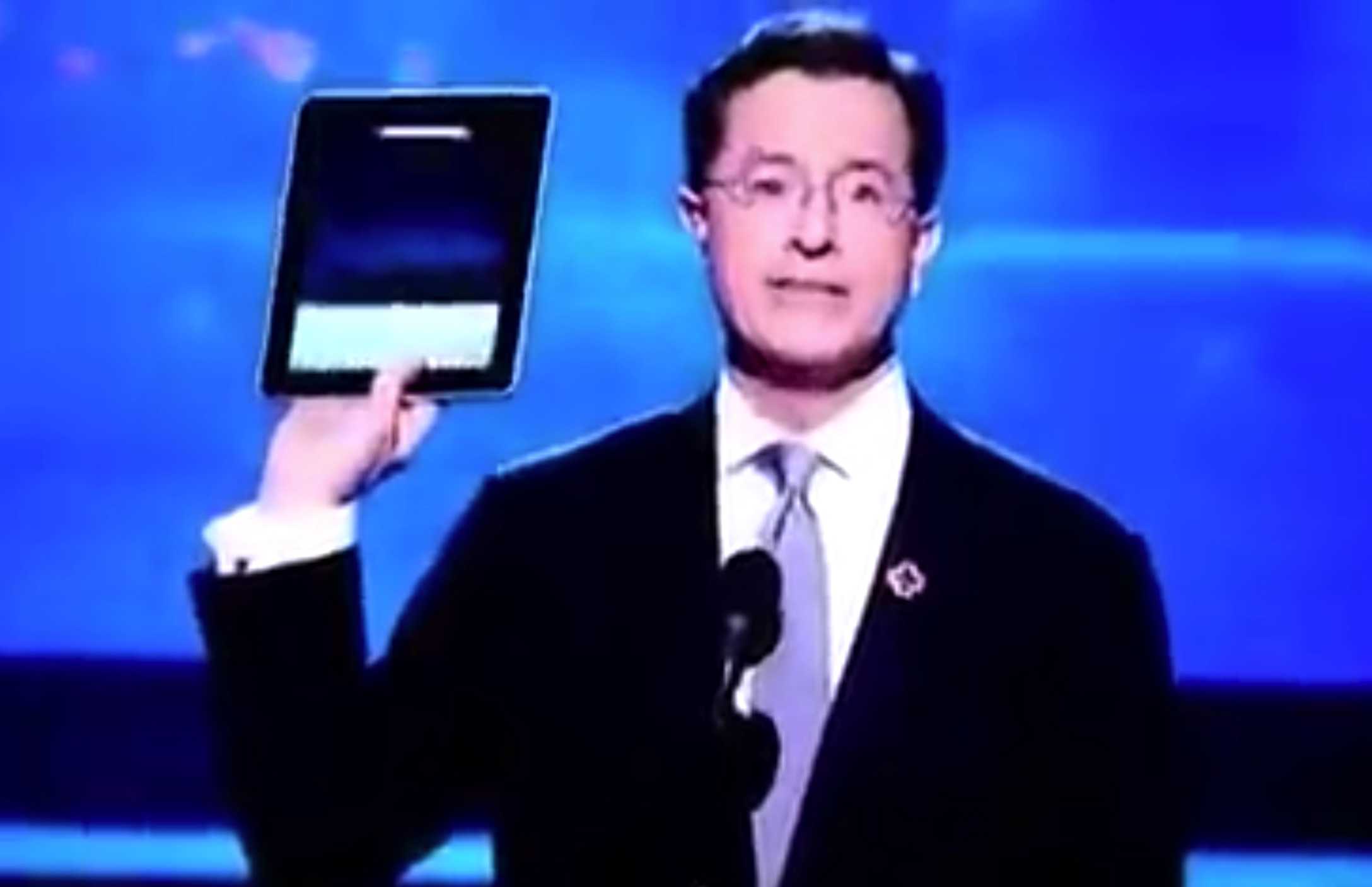 Stephen Colbert shows off a prerelease iPad during the Grammy Awards show.
