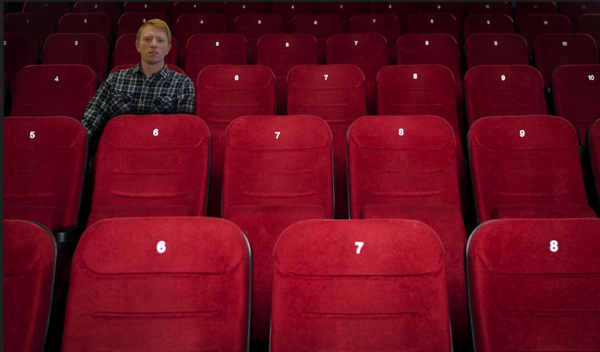 Theatre_Goer_Enjoys_a_Show