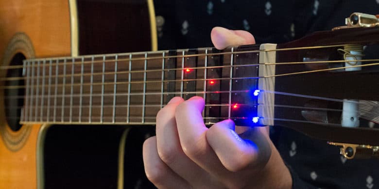 Boring old guitar lessons get a high tech upgrade with this mobile-connected training device.