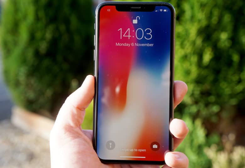 Photo of iPhone X in a person's hand, used to illustrate iPhone X review