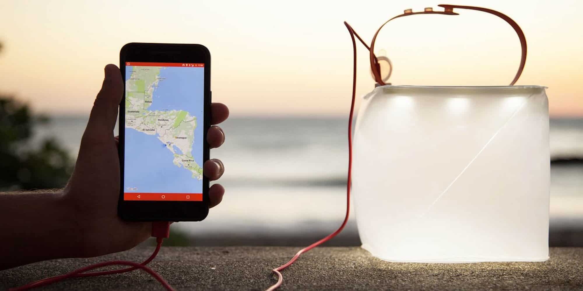 The LuminAid PackLight solar lantern floats in water and charges your phone.