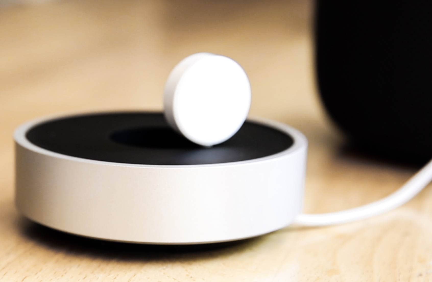 The charging puck sticks out, ready to receive your Apple Watch.