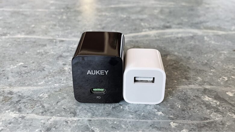 Aukey Minima 18W PD Charger next too Apple 5W iPhone charger.
