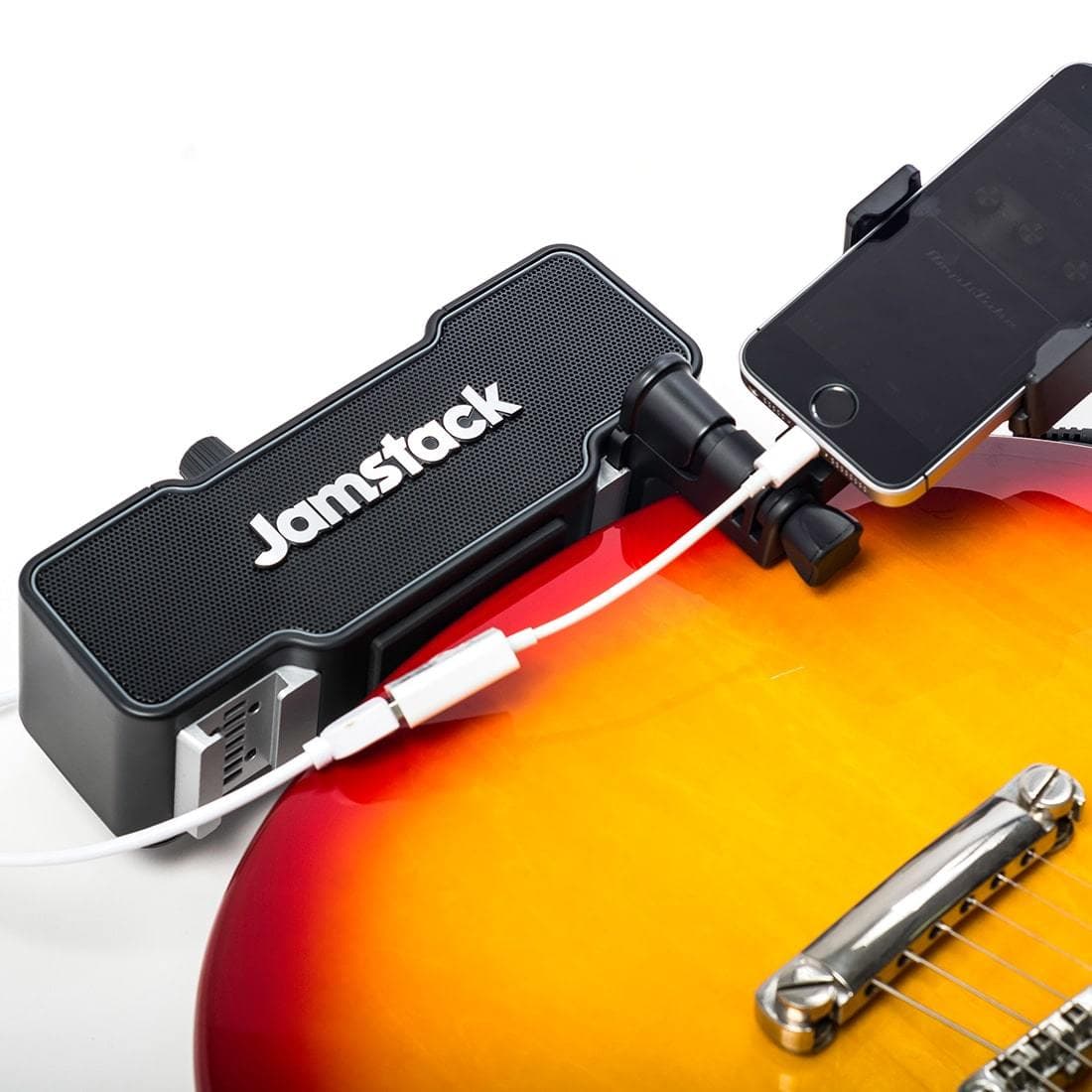 The Jamstack speaker clamps to your guitar.