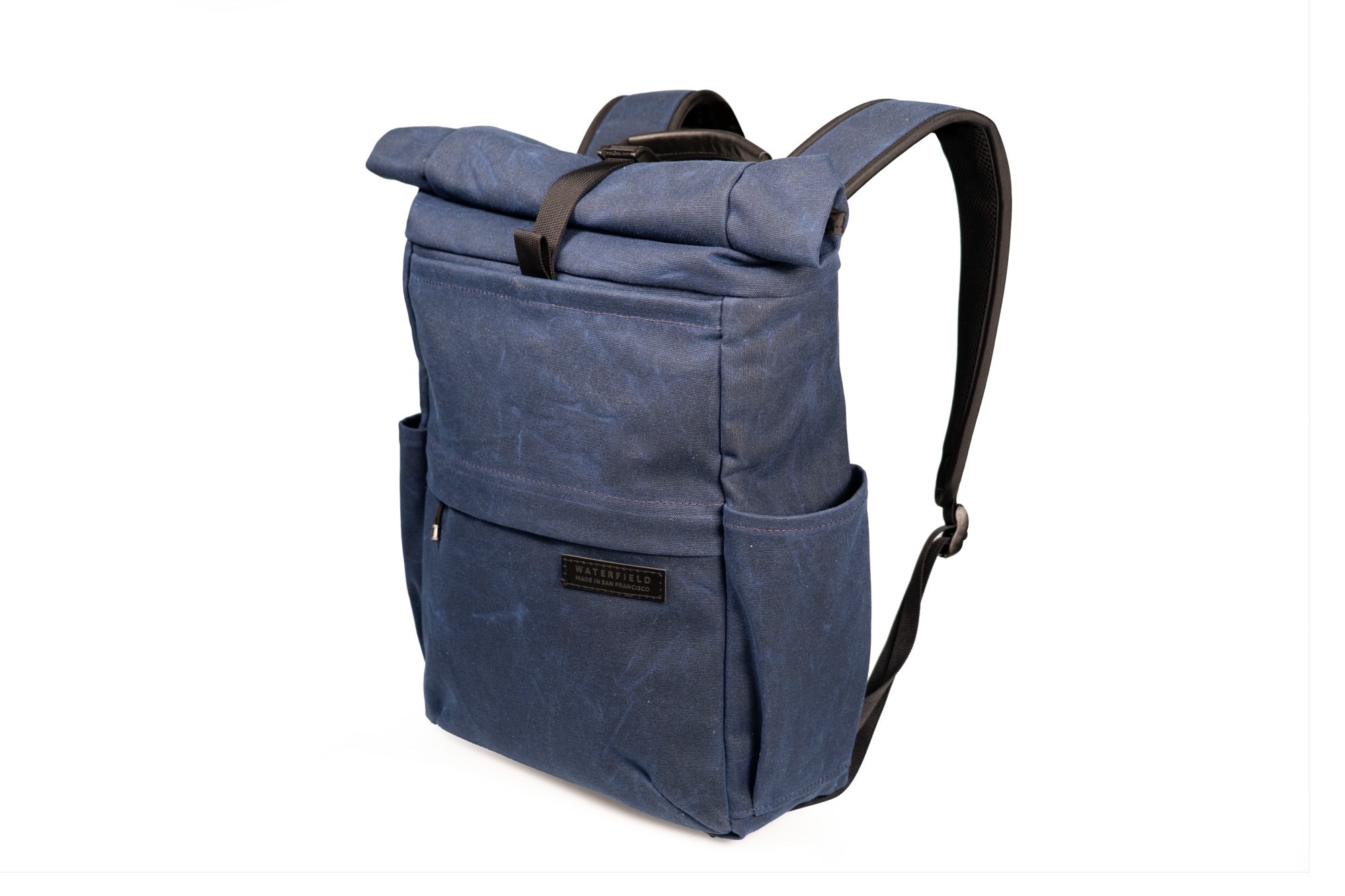 I like the blue waxed canvas version of the WaterField Tech Rolltop.