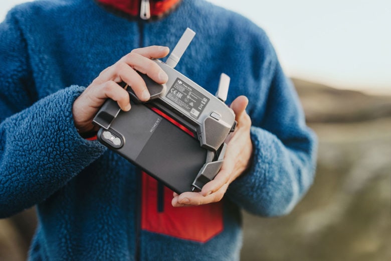 Moment created an ultra-thin case for the iPhone so it can fit on the drone controls