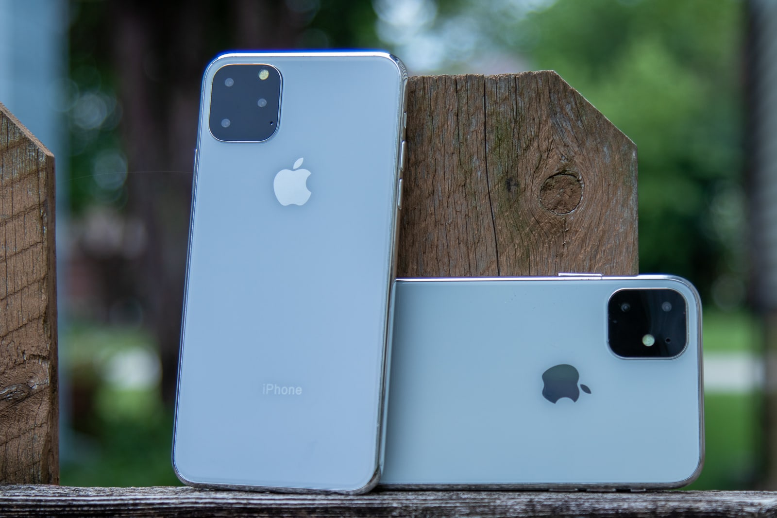 iPhone 11 R and 11 Max on fence post