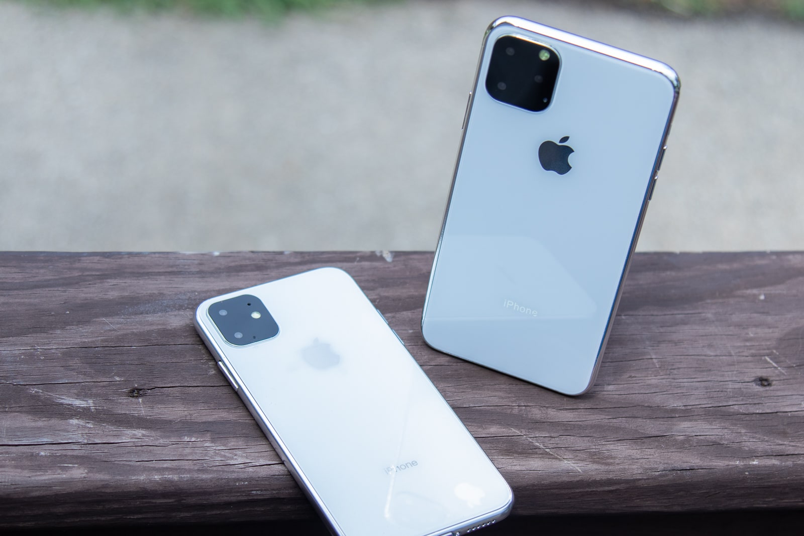 iPhone 11R and 11 Max on wooden railing