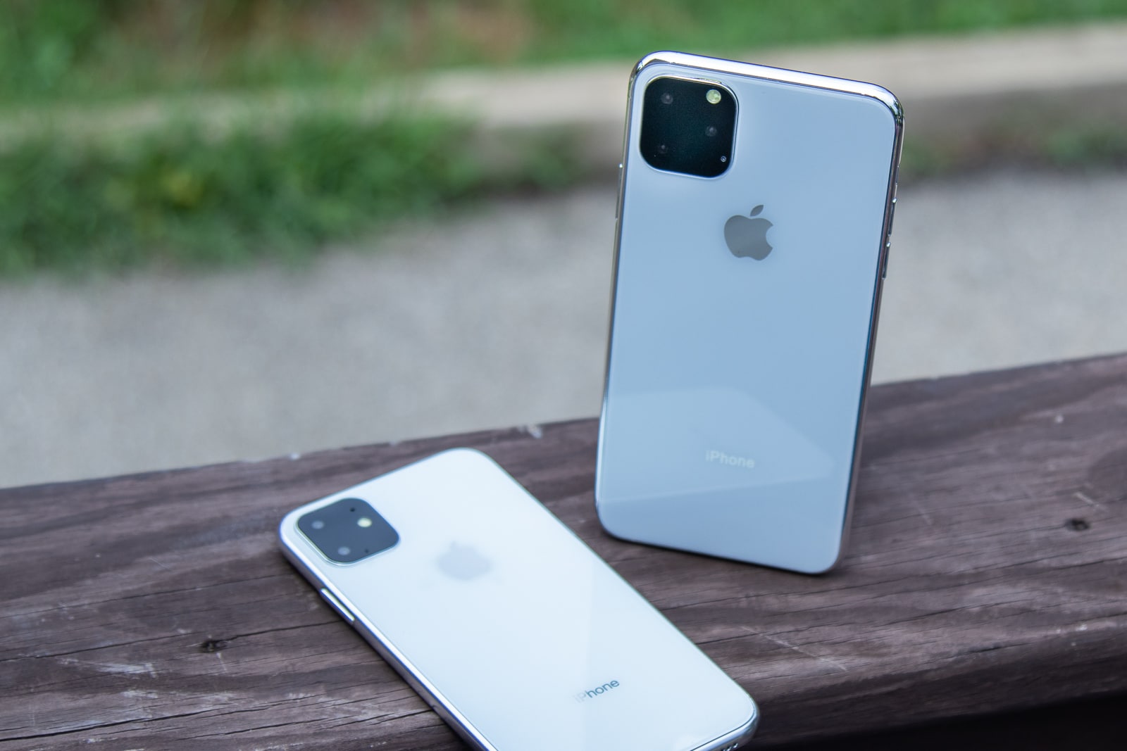 iPhone 11R and 11Max on wooden railing 2
